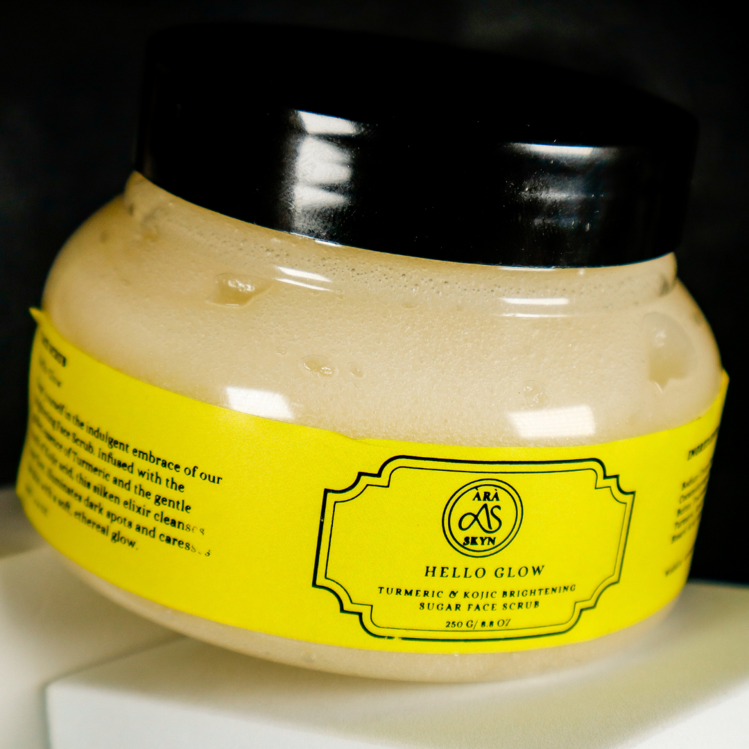 Jar of sugar face scrub with a yellow label on a white surface.